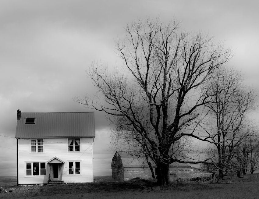 "Cochecton Farmhouse" shows stark against a bleak black-and-white landscape.